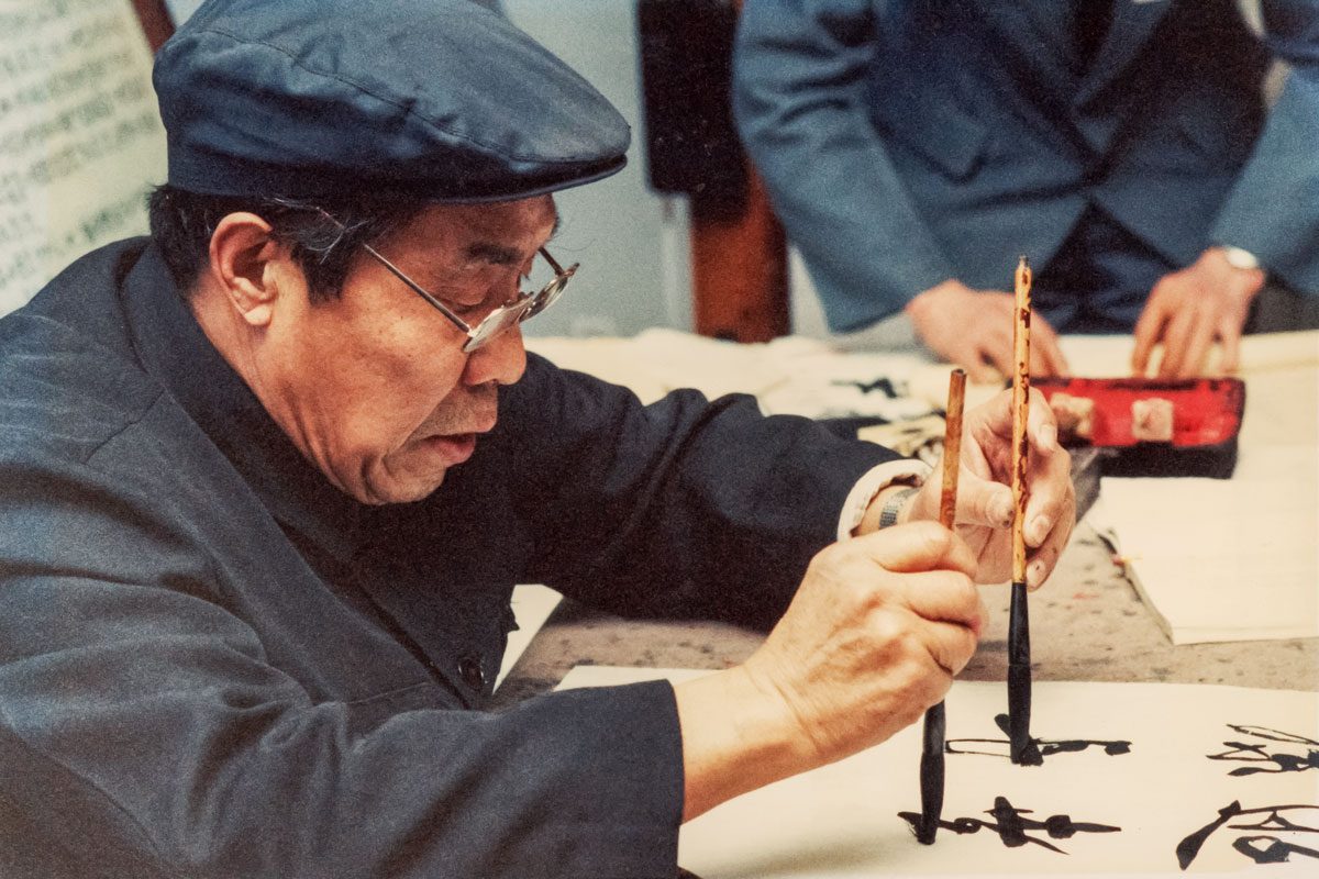 An Ambidextrous Artist Practises Calligraphy