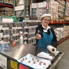 Costco employee handing out a sample