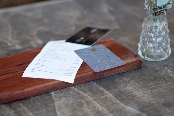 close up of bill with two credit cards