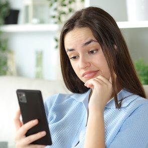 woman looking at her phone