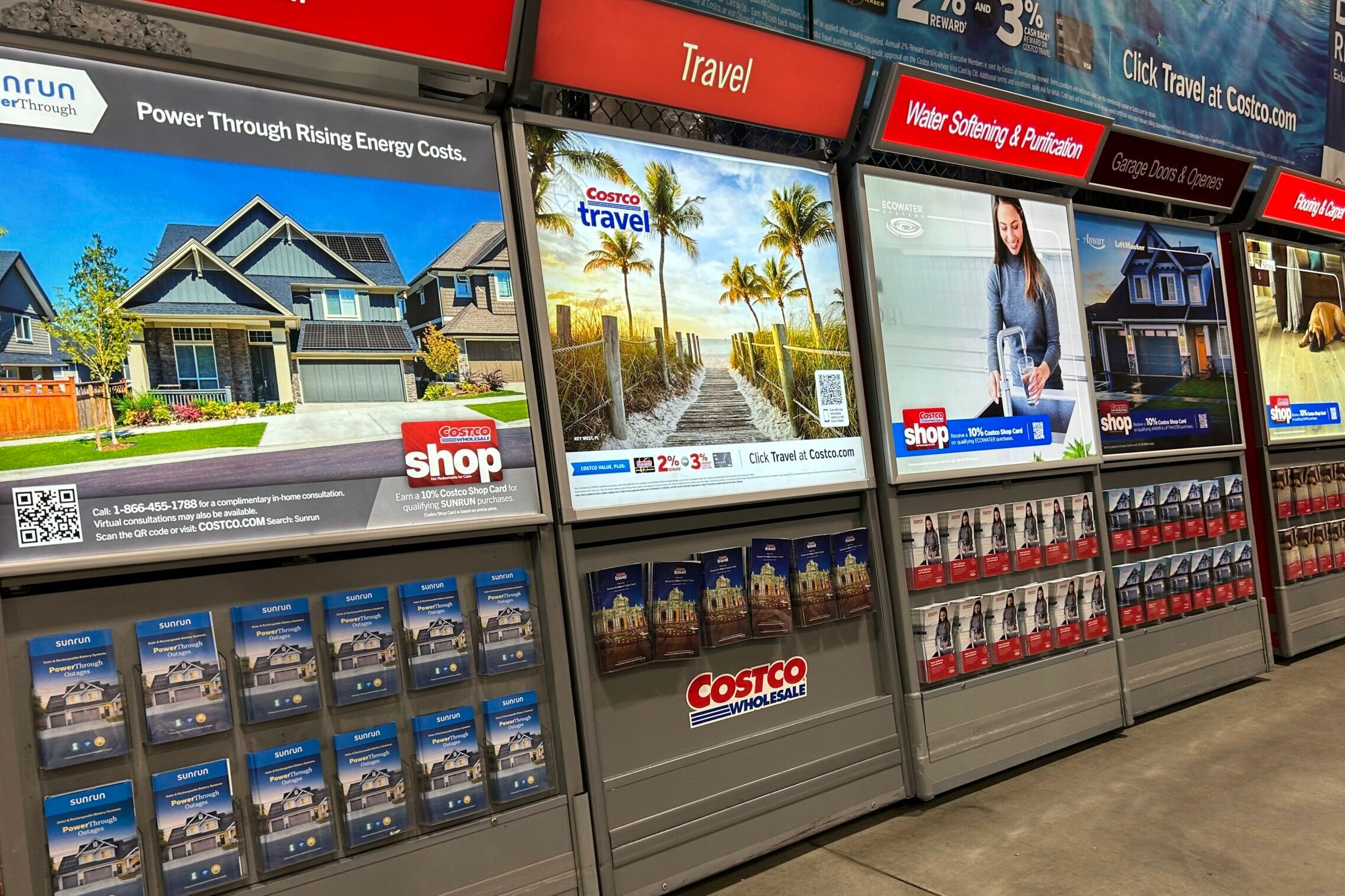 Information kiosk at Costco promoting Solar panels, Travel deals, Water Purification, carpeting and more home, Queens, New York