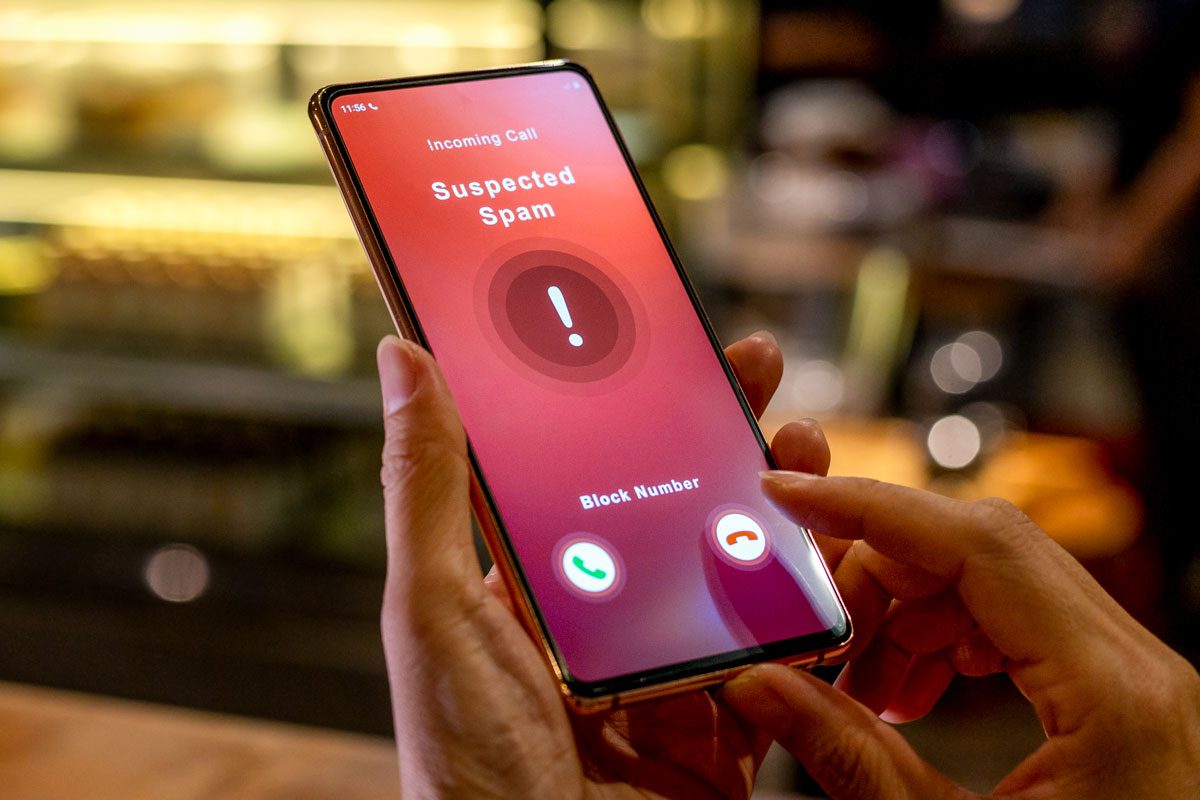 Person Receiving Suspected Spam Call On Smartphone From An Unknown Caller