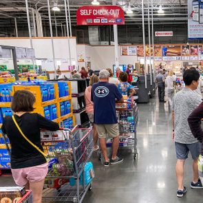 Shoppers are waiting in line to checout at costco store
