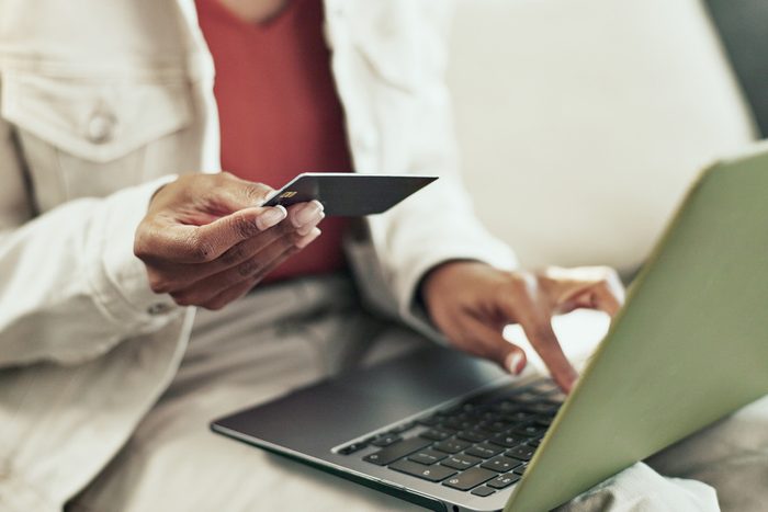 woman using credit card for online shopping