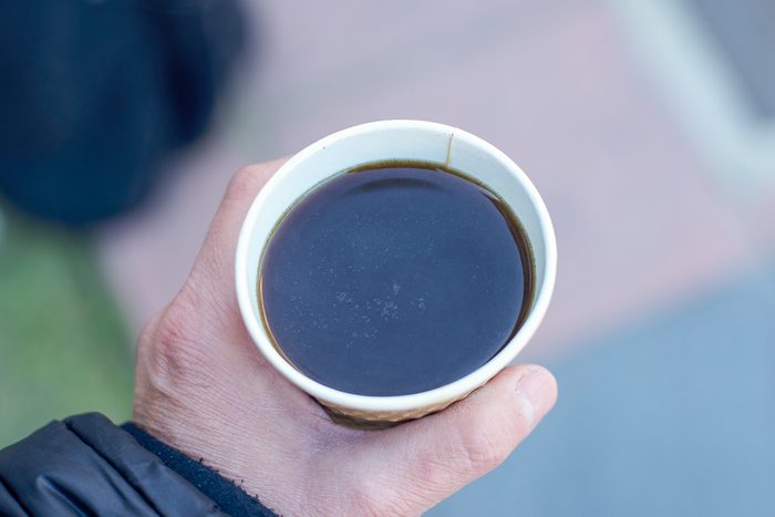 close up of black coffee in a paper cup