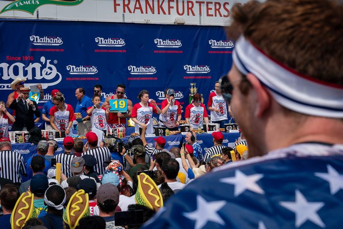 man looking at contestants at an eating competition