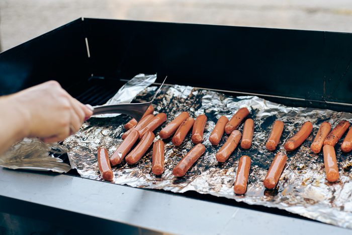 preaparing sausages for hot dogs