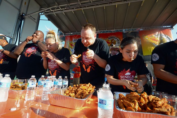 participants at a chicken wings eating contest
