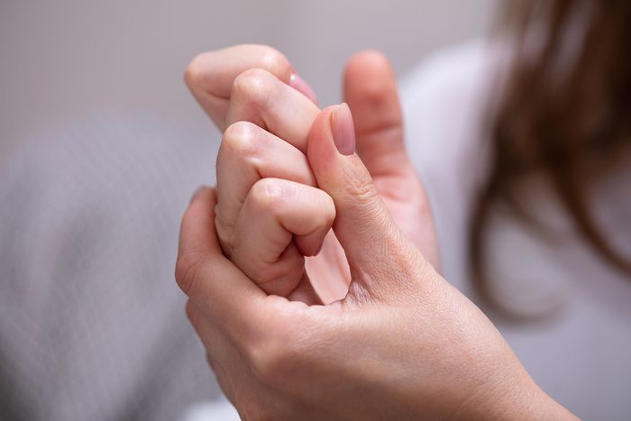 woman cracking her knuckles