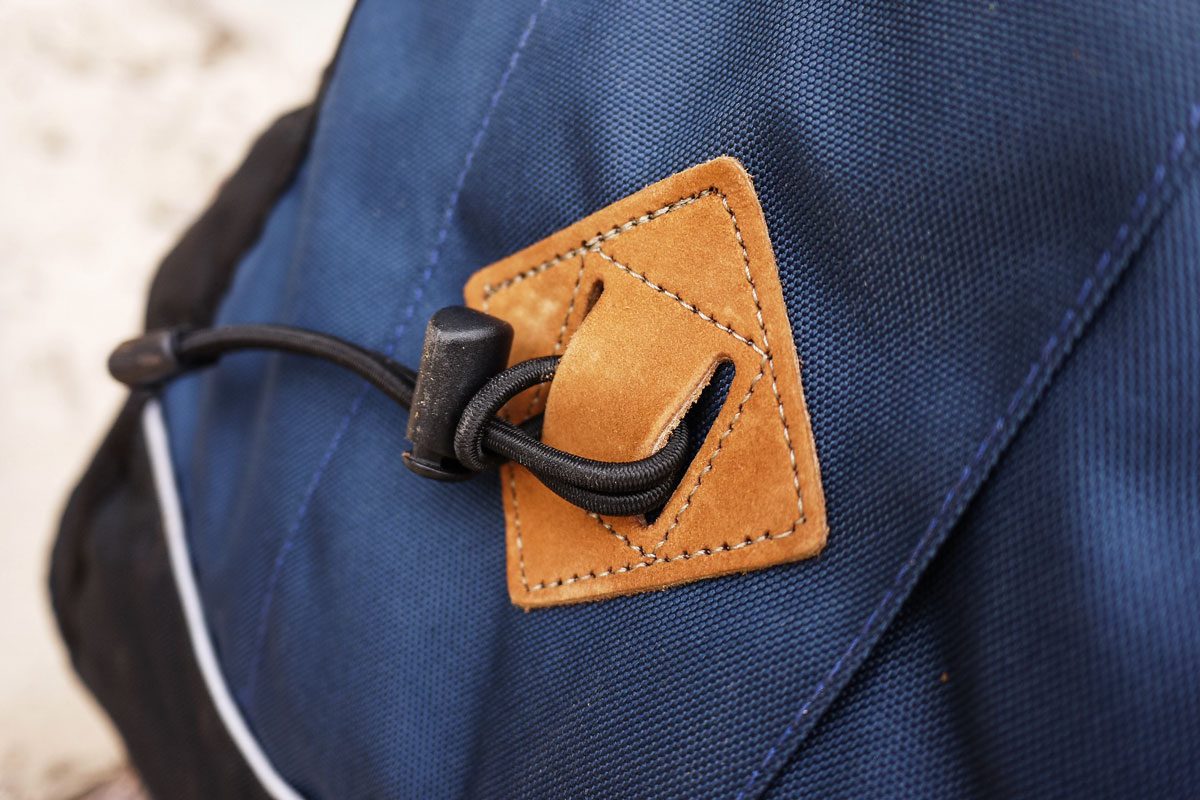 Dark Blue Backpack With Diamond Patch On It