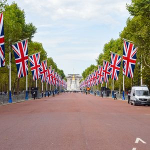 Union Jacks line The Mall leading to Buckingham Palace, London, UK