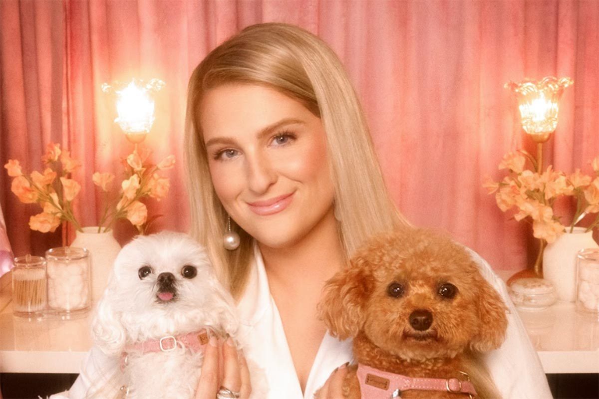 Meghan Trainor with her dogs smiling