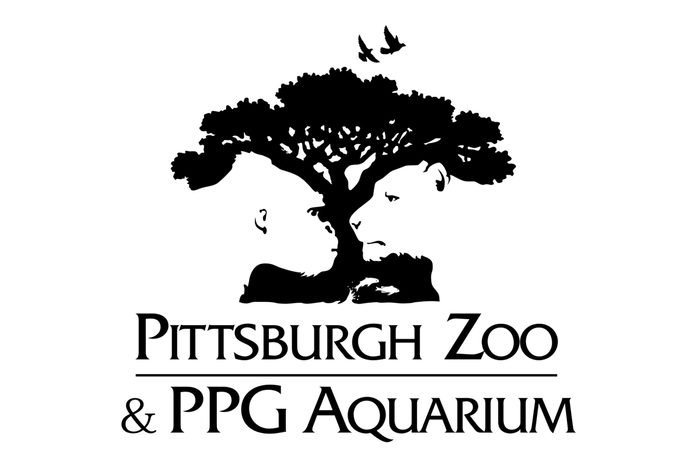 Silhouettes of a gorilla and lion facing each other, shaped by a tree; two birds flying above. Text reads: "Pittsburgh Zoo & PPG Aquarium."