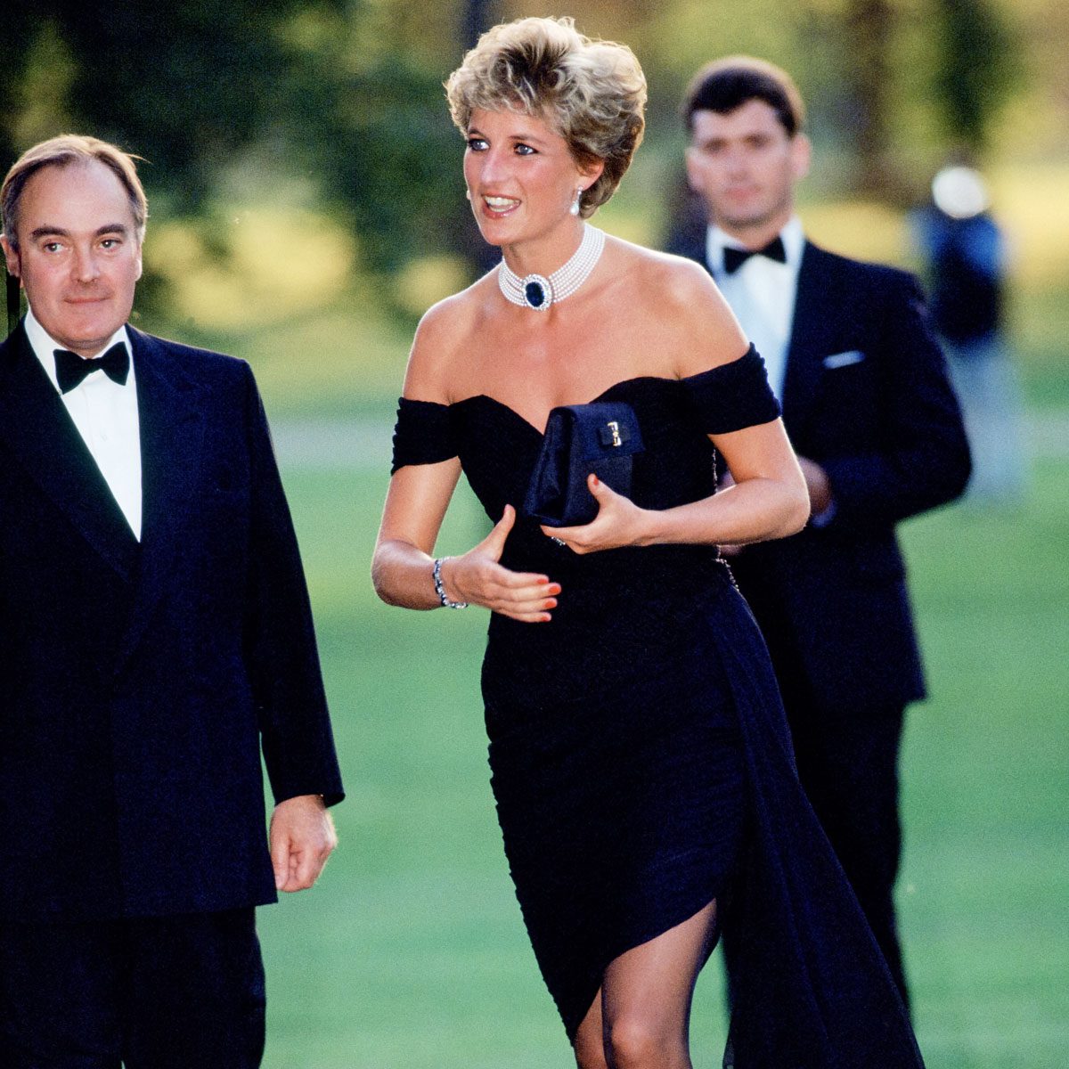 Princess Diana Wearing A Black Cocktail Dress Designed By Christina Stambolian