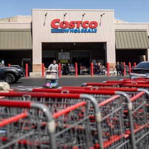 Baskets are lined up in the parking lot of a Costco warehouse