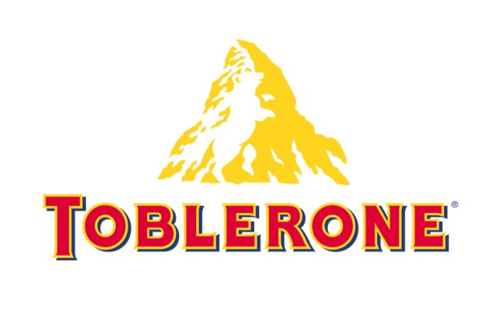 Yellow mountain with hidden bear shape above bold text "TOBLERONE" on a white background.