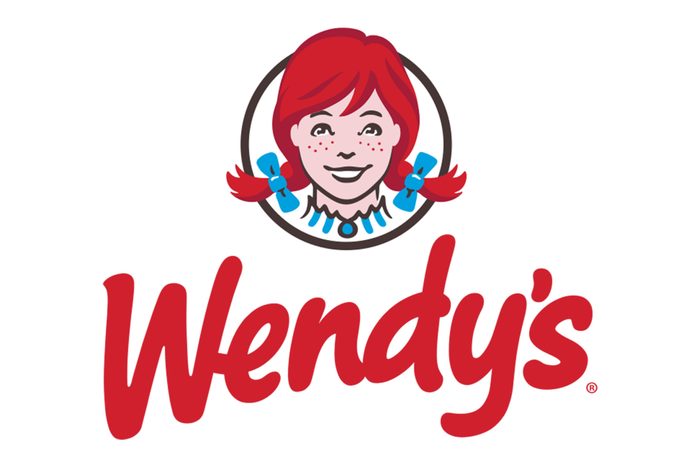 Logo depicting a cartoon girl with red pigtails smiling, encircled; "Wendy's" written below in red script, white background.