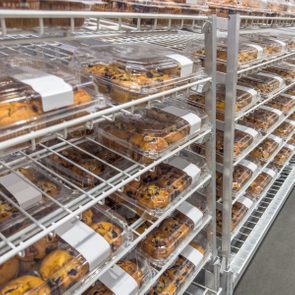 Freshly croissants and muffins in a bakery section of a supermarket